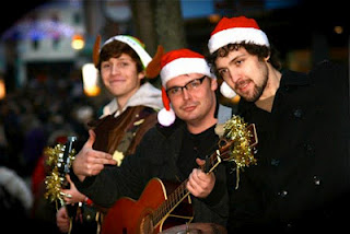 Ian Brough (middle) and Sam Harrison (right) performing at Lincoln's Christmas Market 2011.
