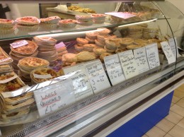 Pies for sale in a shop.