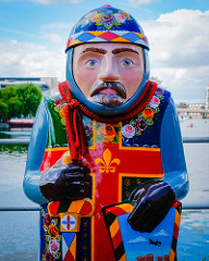 baron statue with a cross on chest . very colourful