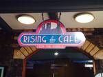 The Rising Café welcome sign.
