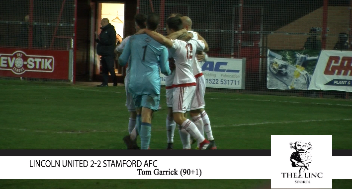 Lincoln United celebrating their dramatic late equaliser.