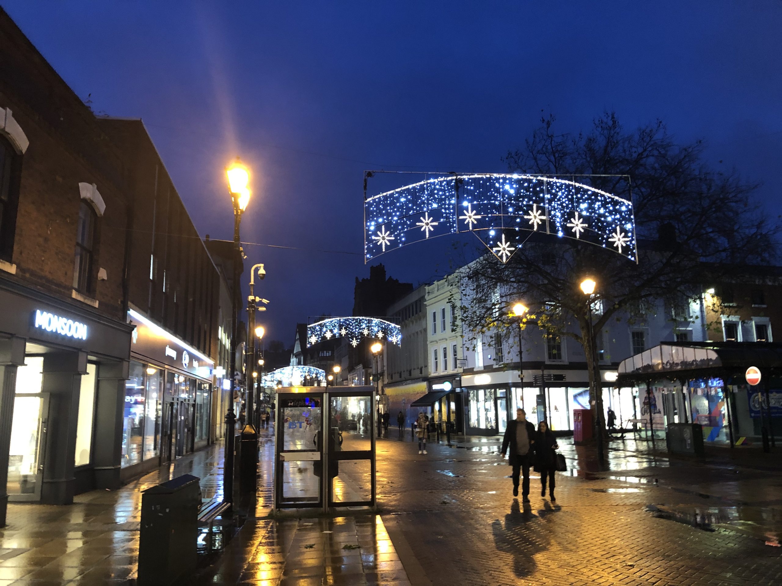 Overhead Christmas lights on the High Street.