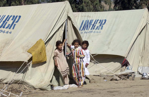 Girls pictured today in Bessian, Jammu and Kashmir, Pakistan at a tent city set up by the Office of the United Nations High Commissioner for Refugees (UNHCR) for some 300 families or 1,600 people.  Up to 10,000 people are expected to arrive at this tent city soon due to the on-coming winter.