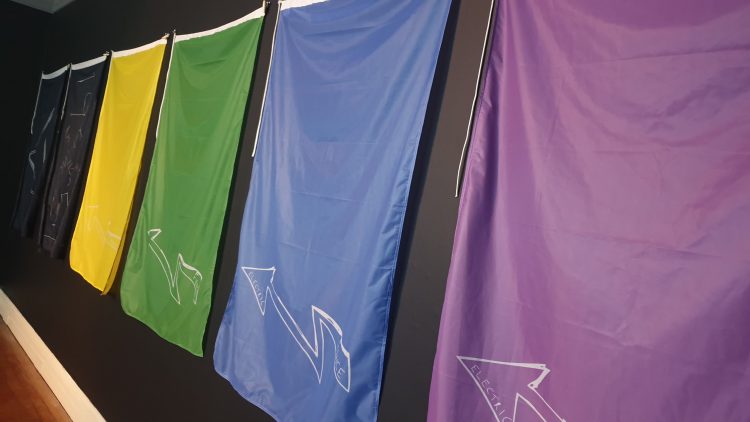The flags of the Electric Fence exhibition at the Usher Gallery, Lincoln. Photo: Bethany Scard.