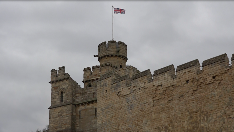 Close up of Lincoln Castle with British flag flying. Photo: Sophie Smith