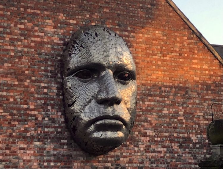 Sculpted in metal, 'The Face' by Rick Kirkby distinguishes the Lincoln Drill Hall, viewed from Free School Lane. It was installed in 2007. Photo by Brooke Becher