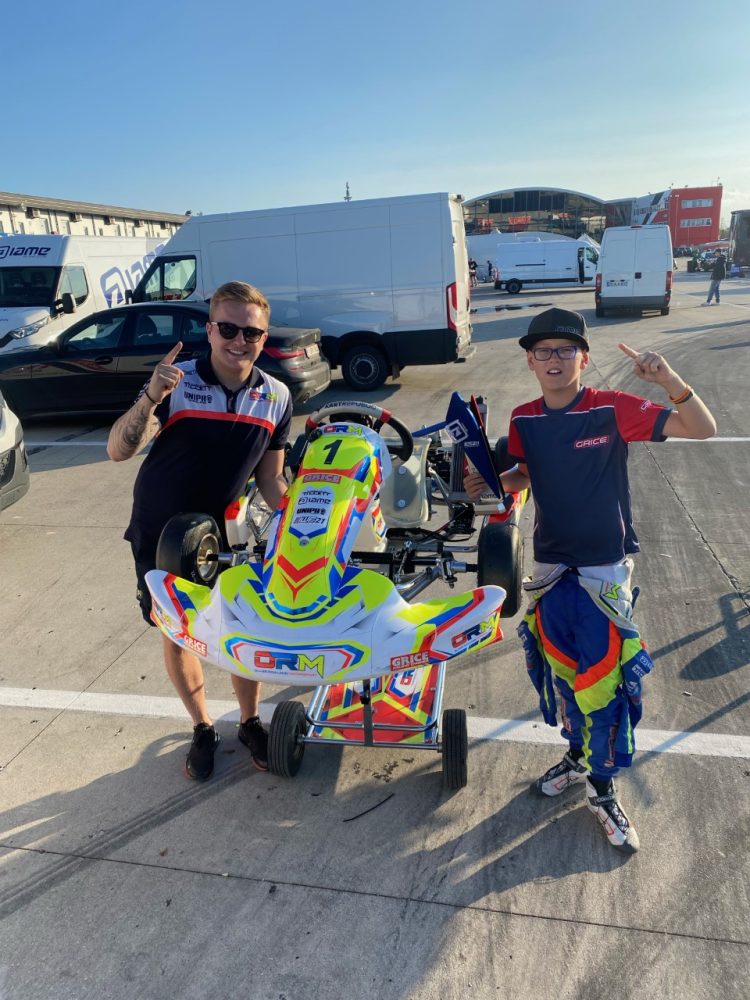 Lewis Wherrell, pictured right, stood with his kart after the championship race.